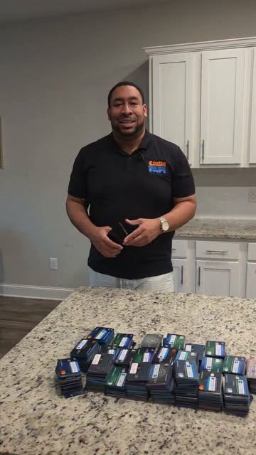 Jeremy Graham standing in a kitchen with a stack of cards