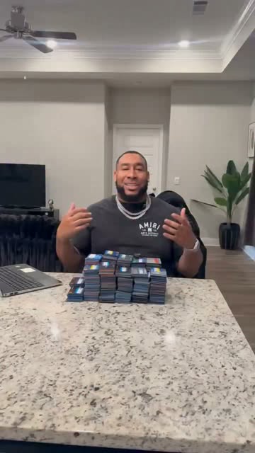 Jeremy Graham at a desk with a stack of cards